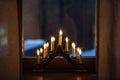 advent candlestick on window sill at night