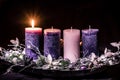 One burning candle on advent wreath