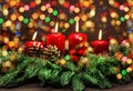 Advent decoration with burning candles and colorful lights Royalty Free Stock Photo