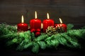 Advent decoration. Four red burning candles. Vintage style Royalty Free Stock Photo