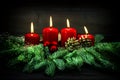 Advent decoration. Four red burning candles. Vintage style Royalty Free Stock Photo