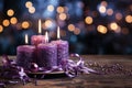 Advent, Four Christmas Purple Candles With Soft Blurry Lights And Glittering On Flames Royalty Free Stock Photo