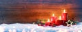 Advent Season - Four Red Candles On Snow Royalty Free Stock Photo