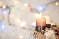 Advent wreath with burning candle and white background with Christmas lights Royalty Free Stock Photo