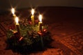 Advent wreath with candles on the round table
