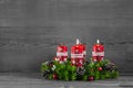 Advent wreath or crown with four red candles on wooden background. Royalty Free Stock Photo