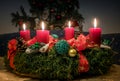 Advent wreath with four lighted red candles Royalty Free Stock Photo