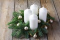 Advent wreath with four white candles, fir branches on wooden background. Sunday December. Traditional diy Christmas decoration Royalty Free Stock Photo