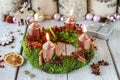 Advent wreath made of moss, cinnamon sticks and rosa canina twigs