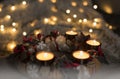 Advent wreath made from natural materials and festive closeup of burning candles Royalty Free Stock Photo