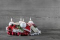 Advent wreath in red and white with four burning candles. Royalty Free Stock Photo