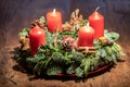 Advent wreath and two burning red candles on a wooden table Studio Royalty Free Stock Photo
