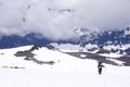 Adventerous shot of a person taking a walk in Mount Rainier National Park during winter