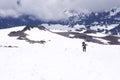 Adventerous shot of a person taking a walk in Mount Rainier National Park during winter