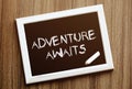 Adventure awaits. Hand writing with copyspace for text. Nice texture