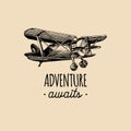 Adventure awaits motivational quote. Vintage retro airplane logo.Hand sketched aviation illustration in engraving style. Royalty Free Stock Photo