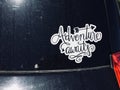 Adventure awaits sticker on back of car