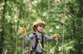 Adventure climbing high wire park. Cute school child boy enjoying a sunny day in a climbing adventure activity park Royalty Free Stock Photo