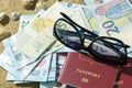 Adventure concept. Traveler items on white table. Glasses, passport, euros, Notepad with pen and shell. Royalty Free Stock Photo