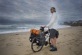 Adventure Cyclist with Bicycle on Beach Royalty Free Stock Photo