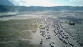 The adventure driving jeep 4WD into Beautiful active Volcano with smoke Mount Bromo