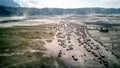 The adventure driving jeep 4WD into Beautiful active Volcano with smoke Mount Bromo