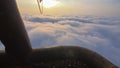 Adventure first person view, pov from basket of field, meadow, river and above cloud in flight on hot air balloon
