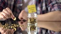 Adventure fund phrase above glass jar with money, savings for hobby, interests Royalty Free Stock Photo