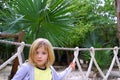 Adventure little girl on jungle park rope bridge Royalty Free Stock Photo