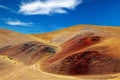 Adventure lonely hiking trail through unreal landscape, colorful dry desert sandstone hills - Coridillera de Copiapo, Atacama,