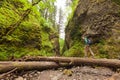 Adventure man hiking with backpack, walking in Oneonta Gorge, outdoor lifestyle Royalty Free Stock Photo