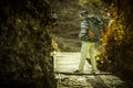Adventure man hiking wilderness mountain with backpack, outdoor Royalty Free Stock Photo