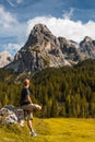 Adventure Man sSitting on Rock after Solo Hiking Dolomites Mountains Royalty Free Stock Photo