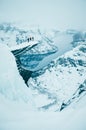 Adventure man standing on the top of the winter rock - white edit space