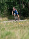 Adventure mountain bike triathlon in hilly forest terrain