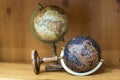 Adventure stories background. Old globe on map background.