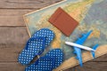 Adventure time concept - plane, map, passport on the wooden desk