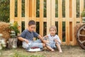 Adventure time. Two cute boys happily eating healthy food outdoors. Royalty Free Stock Photo