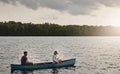 On an adventure to remember. a young couple rowing a boat out on the lake. Royalty Free Stock Photo