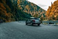 Adventure travel concept background. Car moving fast on empty countryside asphalt road. Traveling enjoy holidays Royalty Free Stock Photo