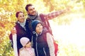 Happy family with backpacks hiking