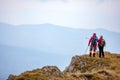 Adventure, travel, tourism, hike and people concept - smiling couple walking with backpacks outdoors Royalty Free Stock Photo