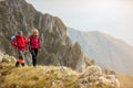 Adventure, travel, tourism, hike and people concept - smiling couple walking with backpacks outdoors Royalty Free Stock Photo