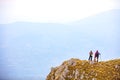 Adventure, travel, tourism, hike and people concept - smiling couple walking with backpacks outdoors Royalty Free Stock Photo