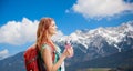 Smiling woman with backpack over alps mountains Royalty Free Stock Photo