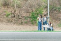 Adventure travel tourism hike people concept. vintage photo group of smiling friends with backpacks and maps outdoors on highway