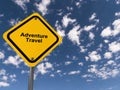 adventure travel traffic sign on blue sky