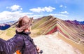 Adventure traveler guy taking selfie at Rainbow Mountain on Vinicunca mount during roadtrip travel experience in Peru Royalty Free Stock Photo