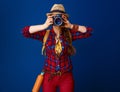 Adventure traveller woman taking photo with digital camera Royalty Free Stock Photo