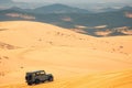 Adventure in Vietnam Jeep car on Mui Ne sand dunes